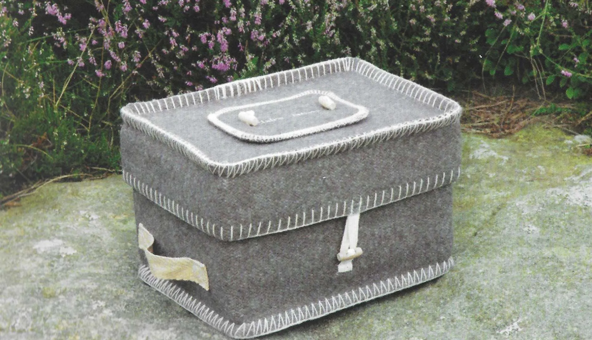 Natural woollen embroidered casket available from Brunskill Family Funerals